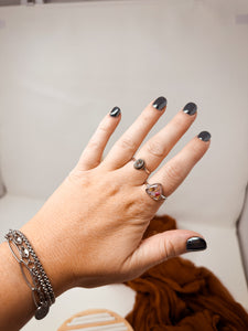 925 Sterling Silver Adjustable Ring-purple with berry toned flowers cast inside resin.