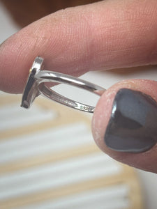 925 Sterling Silver Adjustable Ring-purple with berry toned flowers cast inside resin.