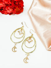 Load image into Gallery viewer, Tear Drop hoops earrings with moon dangles and clear quartz crystals.