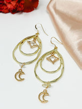 Load image into Gallery viewer, Tear Drop hoops earrings with moon dangles and clear quartz crystals.