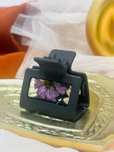 Load image into Gallery viewer, Sm Black Claw Clip Infused with Real Purple Daisy Flowers in Resin.