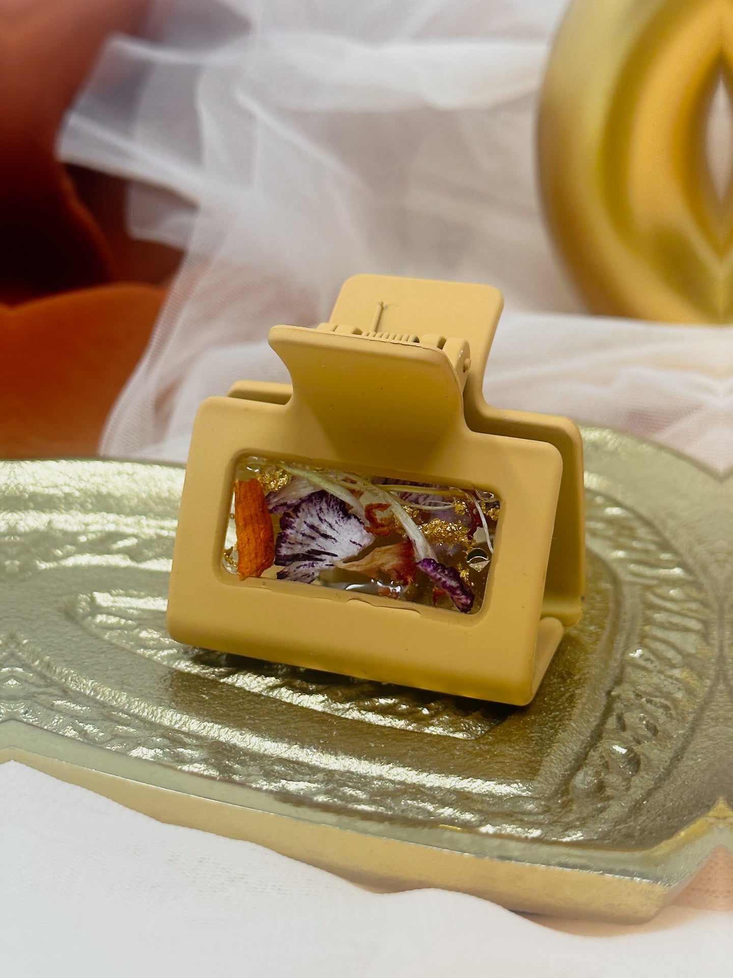 Sm Mustard Clip Infused with Real orange toned Flowers in Resin.