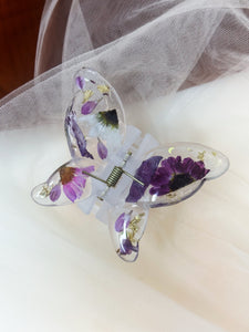 Matte Blue Butterfly Clip Infused with Real Flowers in Resin.
