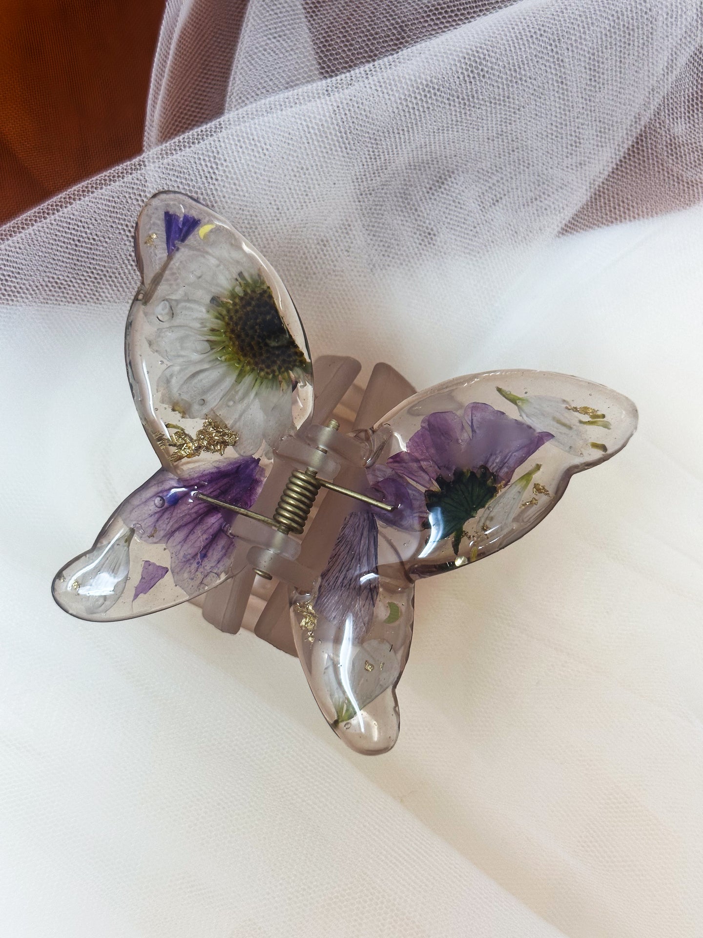 Matte Gray Butterfly Clip Infused with Real Flowers in Resin.