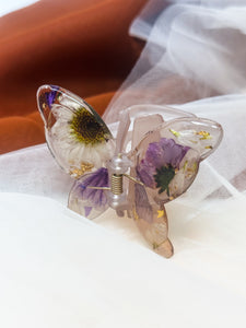 Matte Gray Butterfly Clip Infused with Real Flowers in Resin.