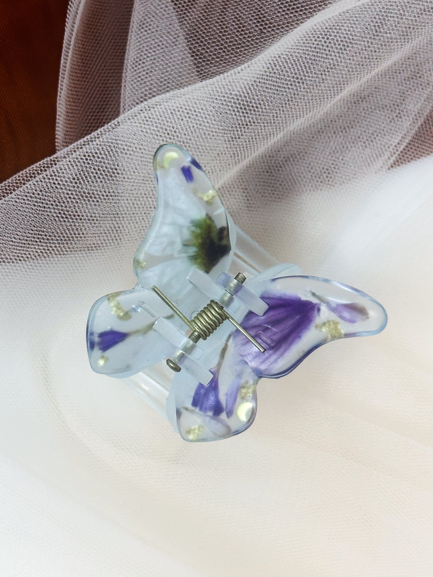 Matte Light Blue Butterfly Clip Infused with Real purple toned Flowers in Resin.