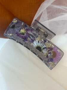 Clear Gray Claw Clip Infused with Real Flowers in Resin with a purple touch.