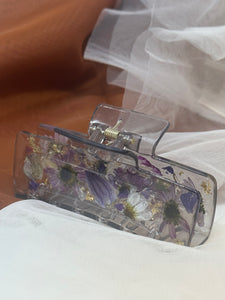 Clear Gray Claw Clip Infused with Real Flowers in Resin with a purple touch.