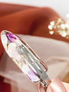 Clear No dent resin clip with Real Pink and White Toned Flowers Cast Inside.