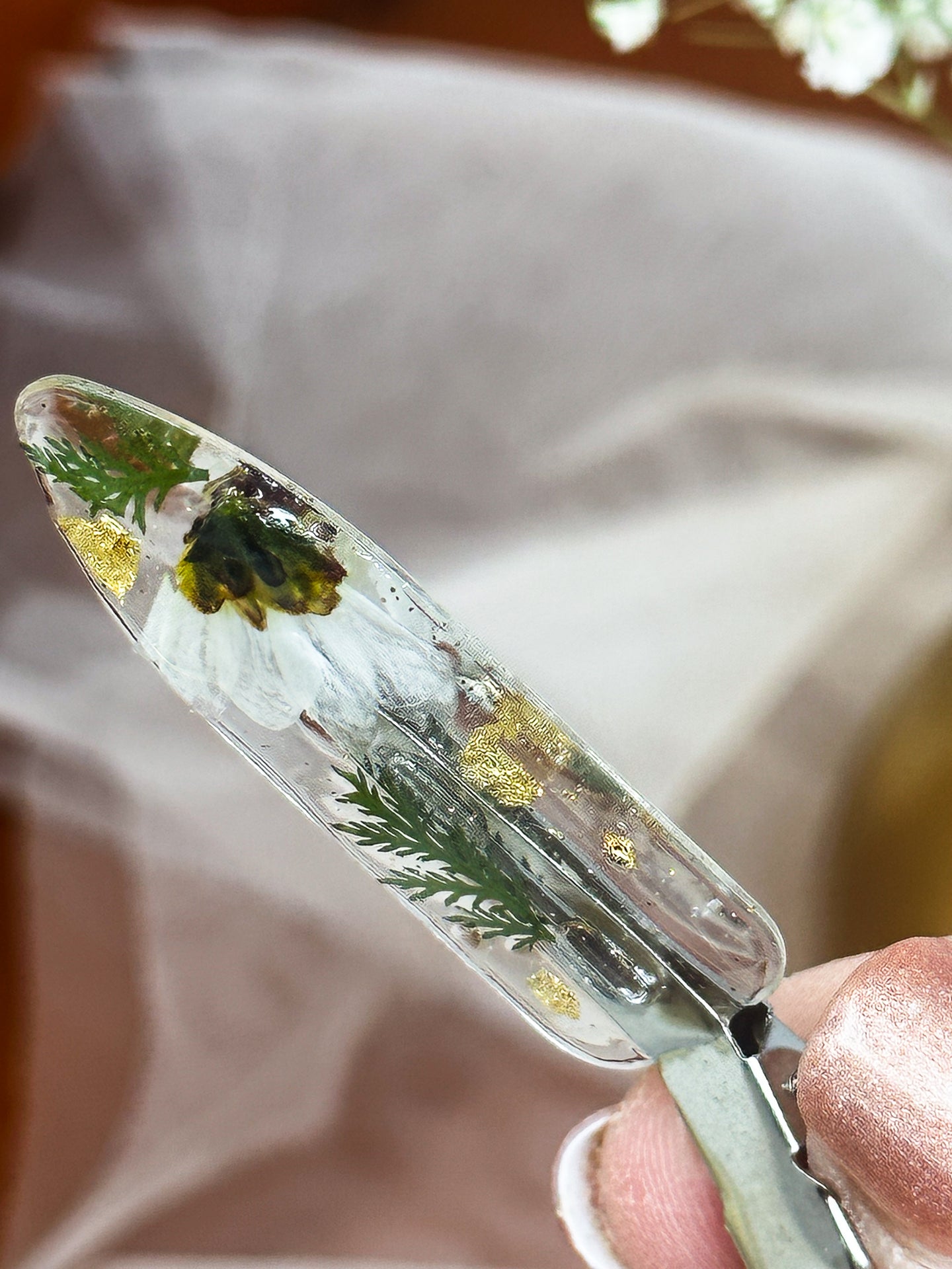 Clear No dent resin clip with Real White Toned Flowers and Greenery Cast Inside.