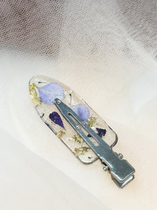 Clear No dent resin clip with Real Purple and Blue Toned Flowers Cast Inside.