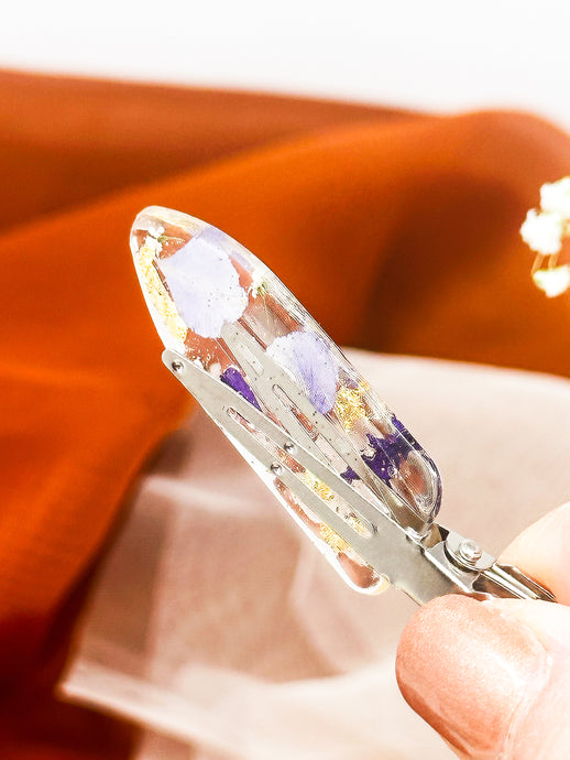 Clear No dent resin clip with Real Purple and Blue Toned Flowers Cast Inside.