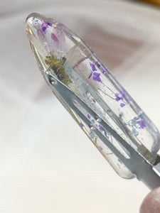 Clear No dent resin clip with Real Daisy's and Purple Toned Flowers Cast Inside.