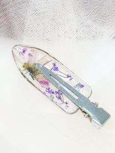 Clear No dent resin clip with Real Daisy's and Purple Toned Flowers Cast Inside.