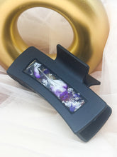 Load image into Gallery viewer, Black Claw Clip Infused with Real Purple Toned Flowers in Resin.