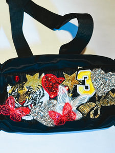 Black belt bag with fun patches including tiger, butterflies, bows etc...
