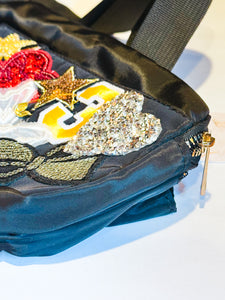Black belt bag with fun patches including tiger, butterflies, bows etc...