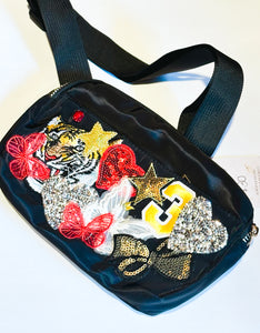 Black belt bag with fun patches including tiger, butterflies, bows etc...