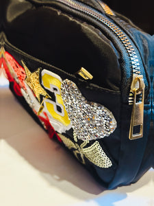 Black belt bag with fun patches including tiger, butterflies, bows etc...